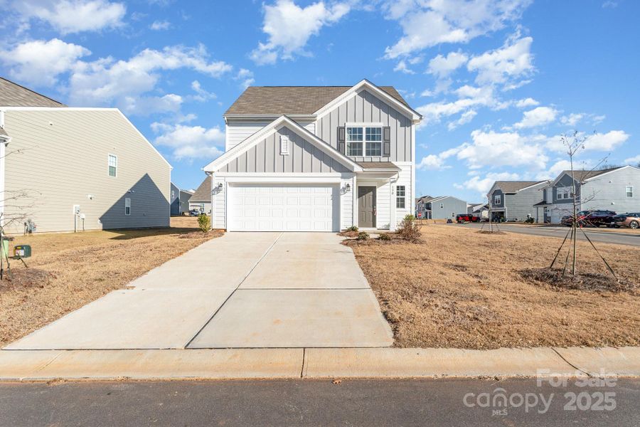 Front exterior of a new home in Sullivan Farm, Statesville, NC, highlighting curb appeal (Image 1). Front exterior of a new home in Sullivan Farm, Statesville, NC, highlighting curb appeal (Image 1).