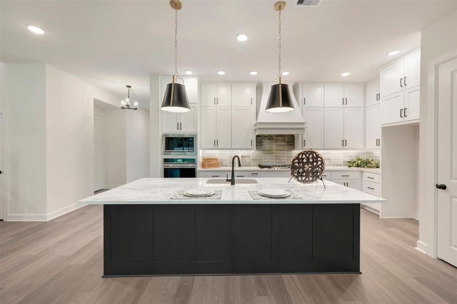 Low maintenance laminate floors compliment this beautiful home!  Walk in pantry and storage under stairs!