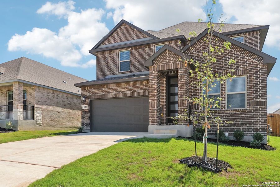 Front exterior of a new home in Arcadia Ridge - Premier Series, San Antonio, TX, highlighting curb appeal (Image 2).