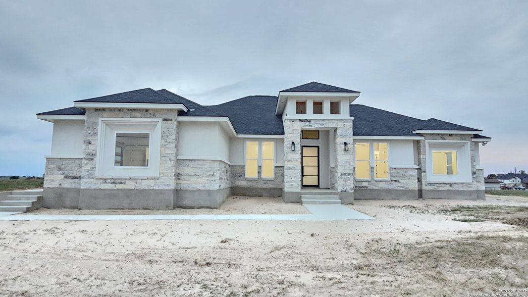 Front exterior of a new home in , La Vernia, TX, highlighting curb appeal (Image 23).