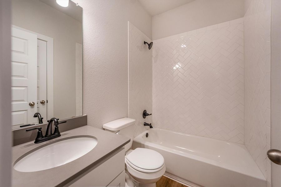 Furnished interior view inside a new home in Deer Pines, Conroe (Image 10).