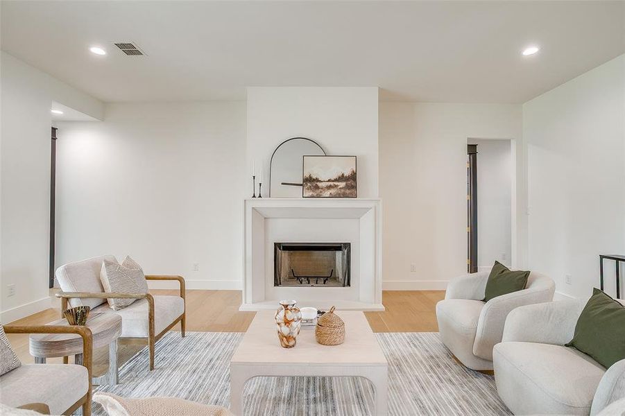 Cast stone wood burning fireplace as the focal point