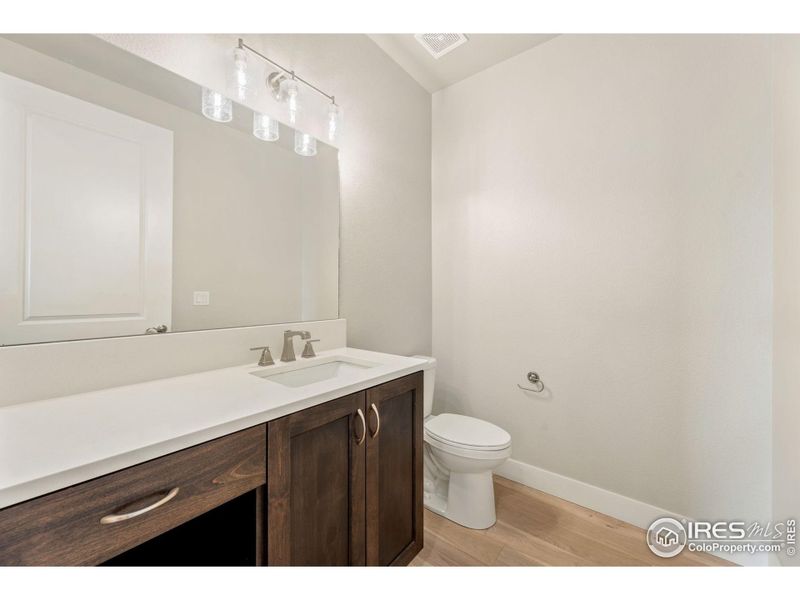 Main Floor half bath for guests is practical and convenient.