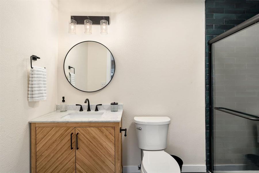 The bathroom delivers the same punchy style and function. New vanity, sink, fixtures, etc.