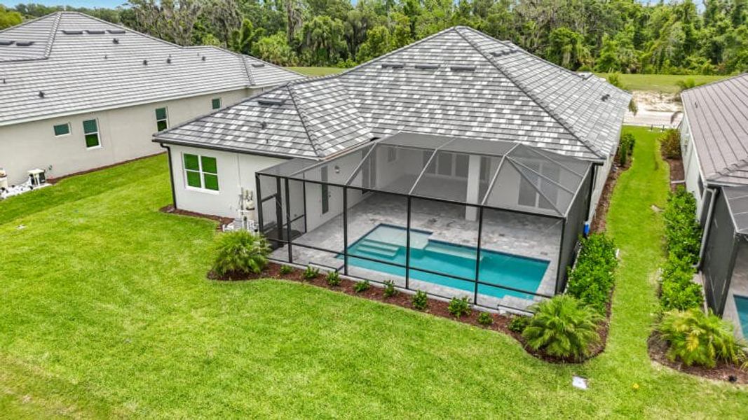 Exterior details and patio area of a home in River Preserve Estates, Parrish (Image 32).