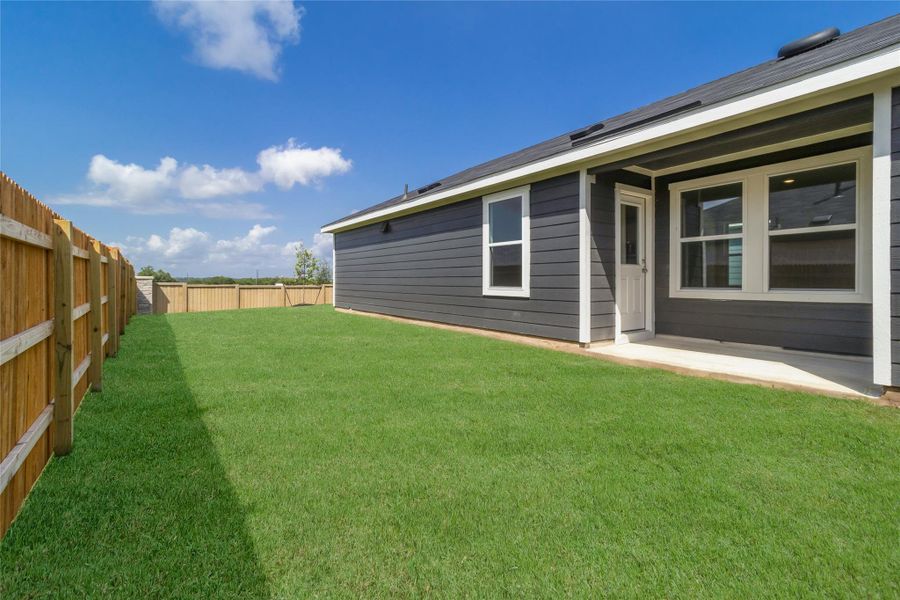 Front exterior of a new home in Marigold, Uhland, TX, highlighting curb appeal (Image 14). Front exterior of a new home in Marigold, Uhland, TX, highlighting curb appeal (Image 14).