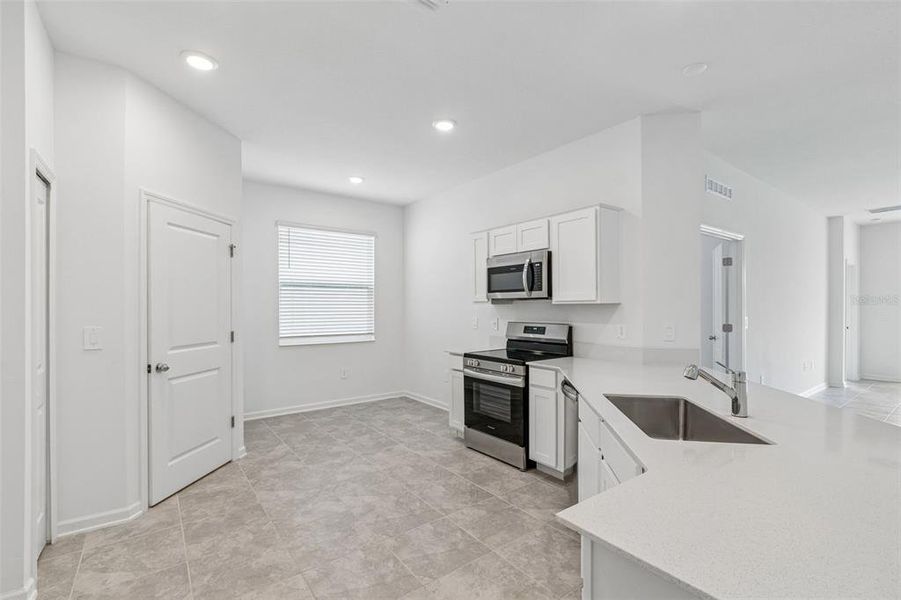 Furnished interior view inside a new home in Peace Creek Reserve, Winter Haven (Image 28).