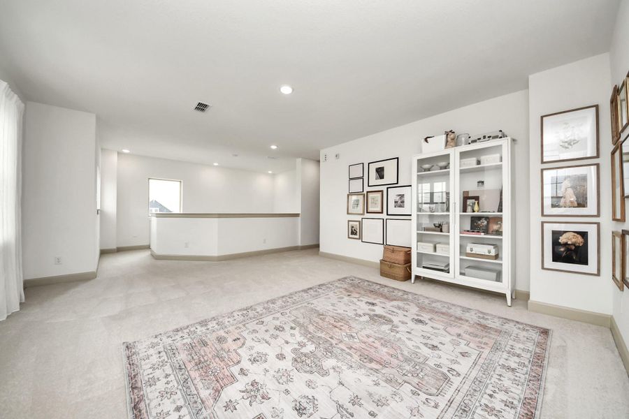 Flexible open space upstairs for an office, gameroom or media room.