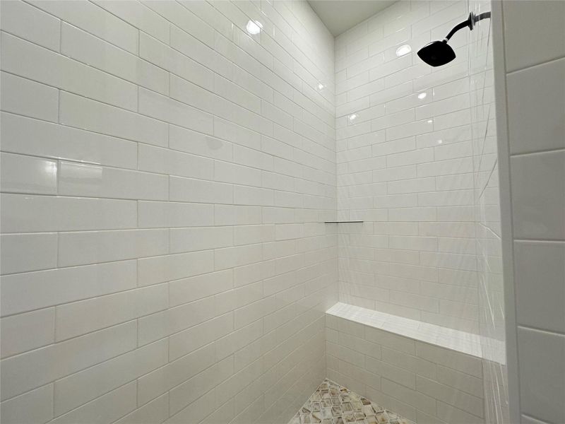 Bathroom featuring a tile shower