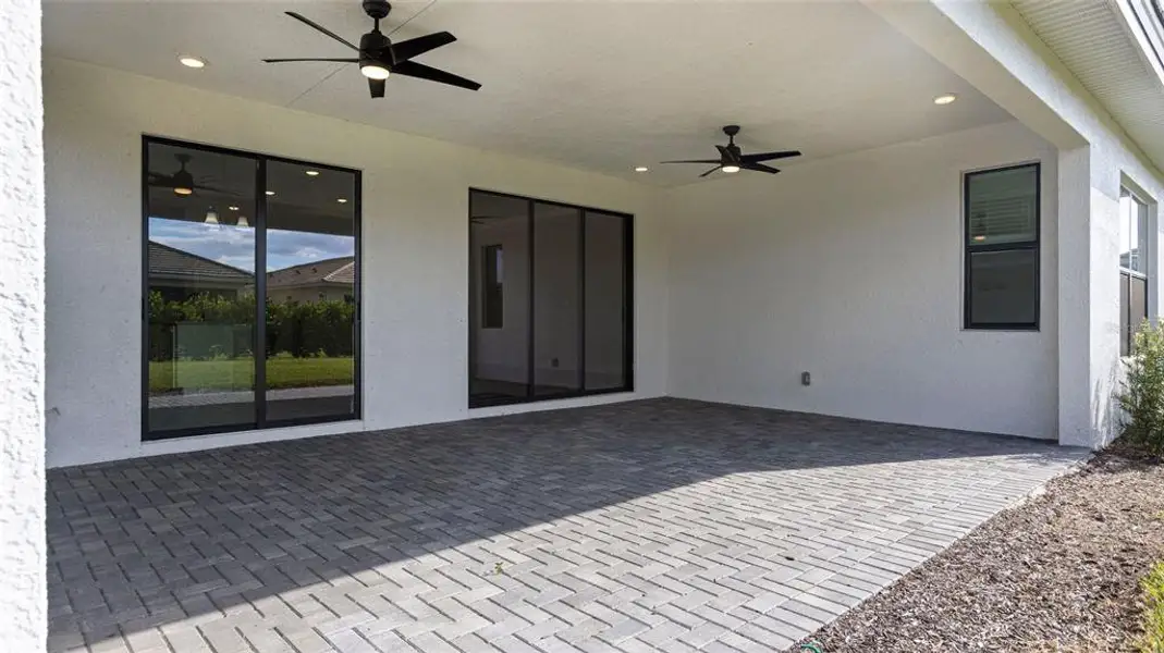 Exterior details and patio area of a home in Cresswind Lakewood Ranch, Lakewood Ranch (Image 3).