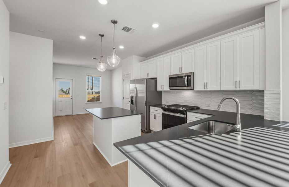 Furnished interior view inside a new home in Crosswinds, Kyle (Image 5).