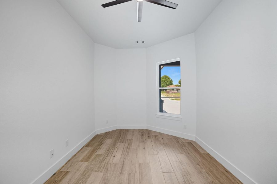 Empty room featuring light wood-style floors and baseboards Empty room featuring light wood-style floors and baseboards