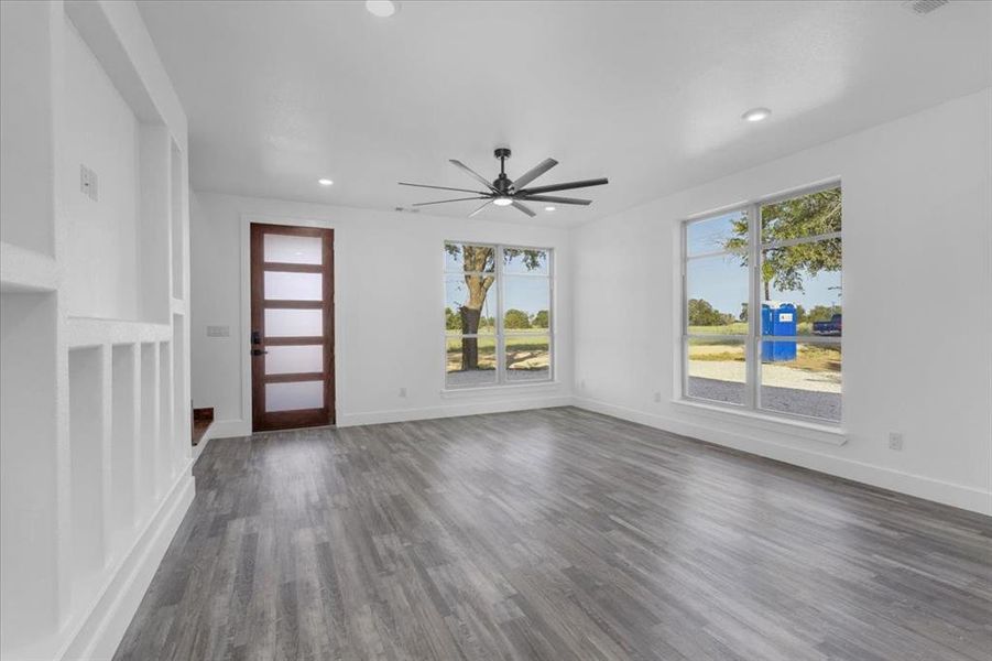 Entryway with ceiling fan and dark hardwood / wood-style flooring