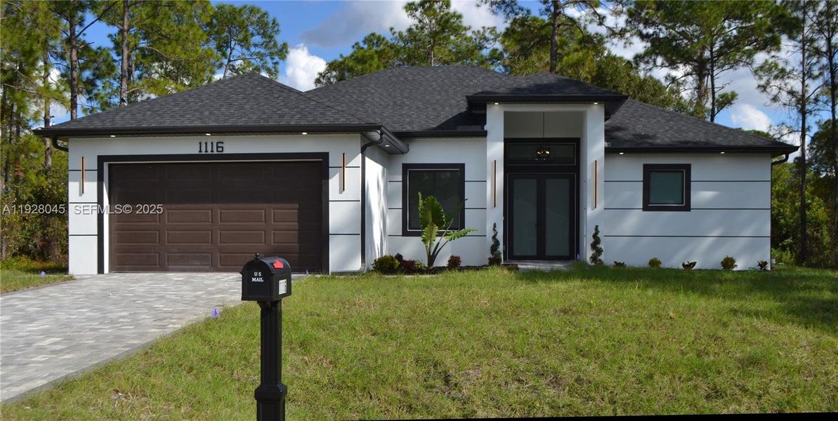 Front exterior of a new home in , Lehigh Acres, FL, highlighting curb appeal (Image 1).