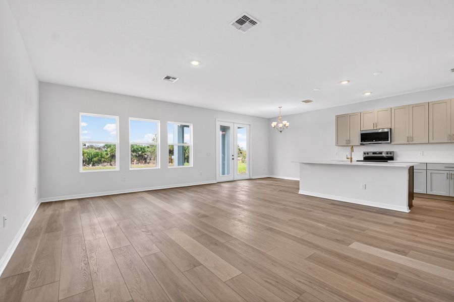 Representative unfurnished interior of a home built from the Sebago by Ashton Woods in Catamaran Cove, Rockledge (Image 6).