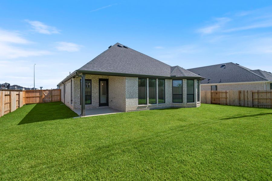 Front exterior of a new home in Katy Court, Katy, TX, highlighting curb appeal (Image 15). Front exterior of a new home in Katy Court, Katy, TX, highlighting curb appeal (Image 15).