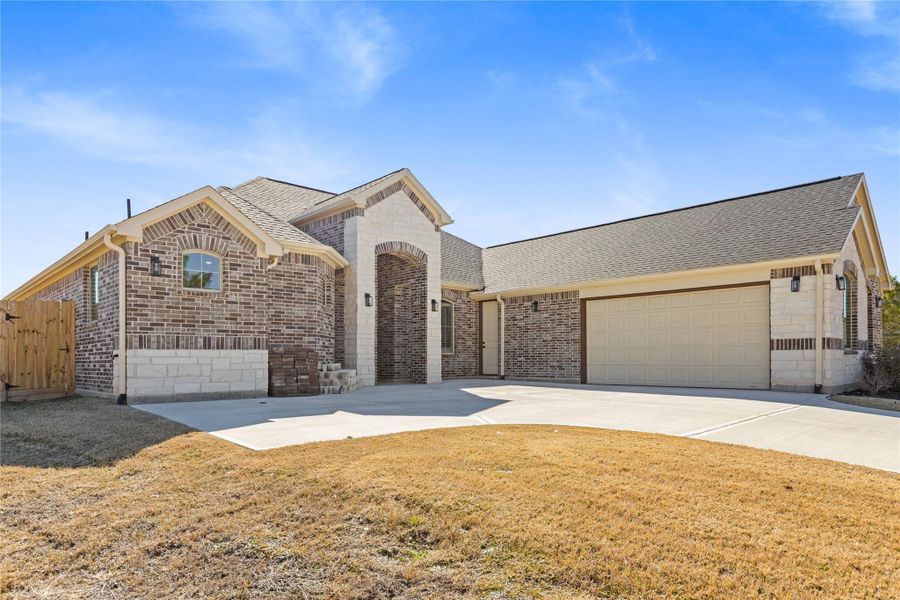 Front exterior of a new home in Bentwater, Montgomery, TX, highlighting curb appeal (Image 23).