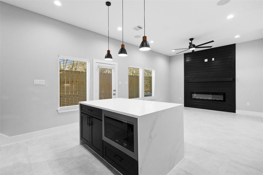 Standing at the island, you appreciate how the open view connects your kitchen to the living space, so you never miss a moment of the conversation.