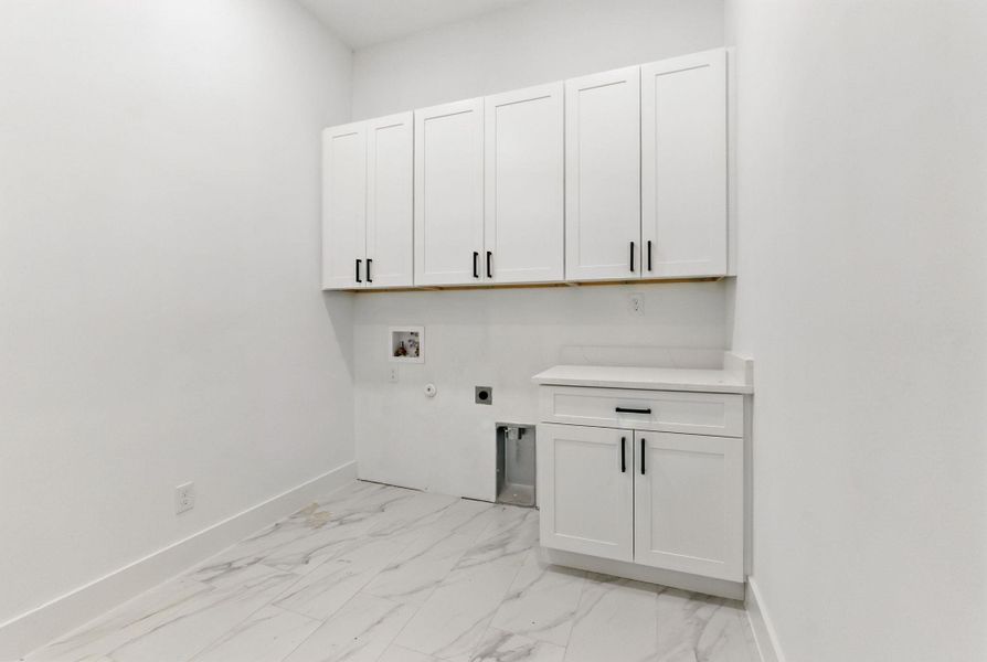 Washroom with hookups and cabinet space