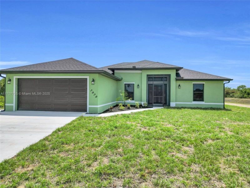 Front exterior of a new home in , Labelle, FL, highlighting curb appeal (Image 2). Front exterior of a new home in , Labelle, FL, highlighting curb appeal (Image 2).