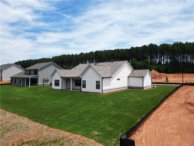 Front exterior of a new home in Weslyn Park, Social Circle, GA, highlighting curb appeal (Image 18). Front exterior of a new home in Weslyn Park, Social Circle, GA, highlighting curb appeal (Image 18).
