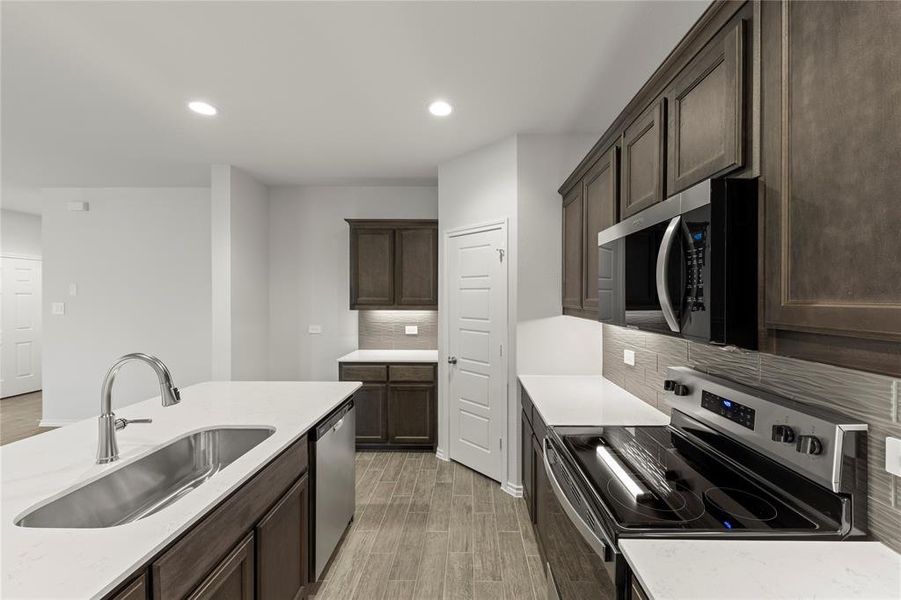 Furnished interior view inside a new home in Keeneland, Aubrey (Image 6). Furnished interior view inside a new home in Keeneland, Aubrey (Image 6).