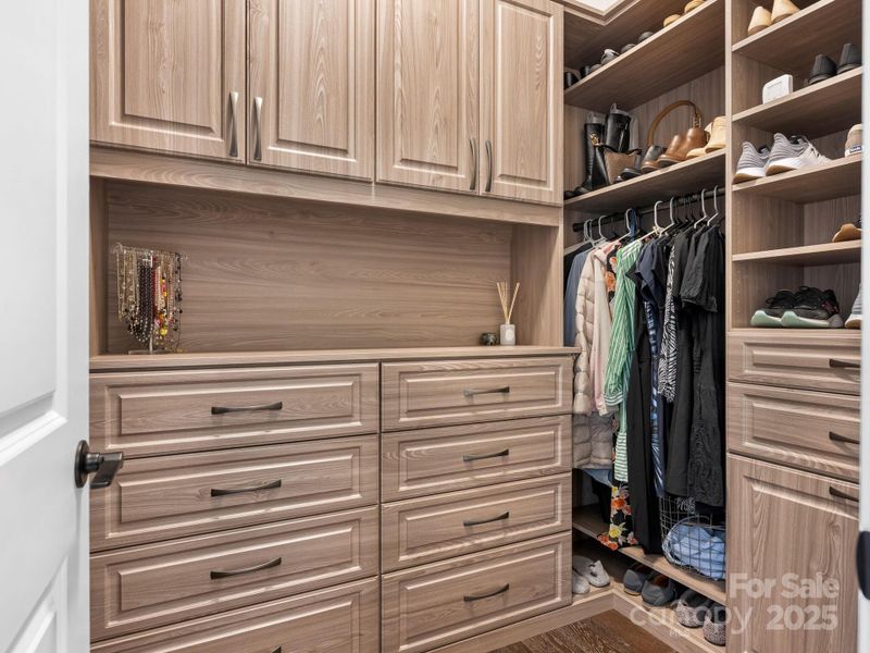 1st Flr, one of two, custom closet systems w/drawers and adjustable shelving.