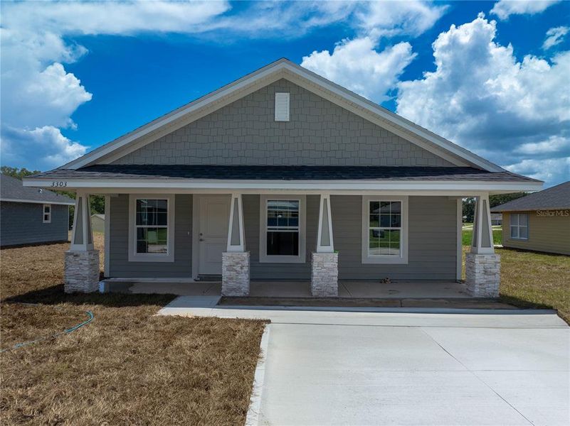Front exterior of a new home in Rolling Hills, Bell, FL, highlighting curb appeal (Image 2).