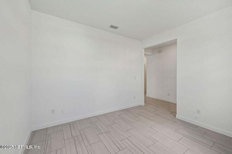 Spacious, unfurnished interior of a new home in Lakes at Bella Lago - Signature Series, Green Cove Springs (Image 27).