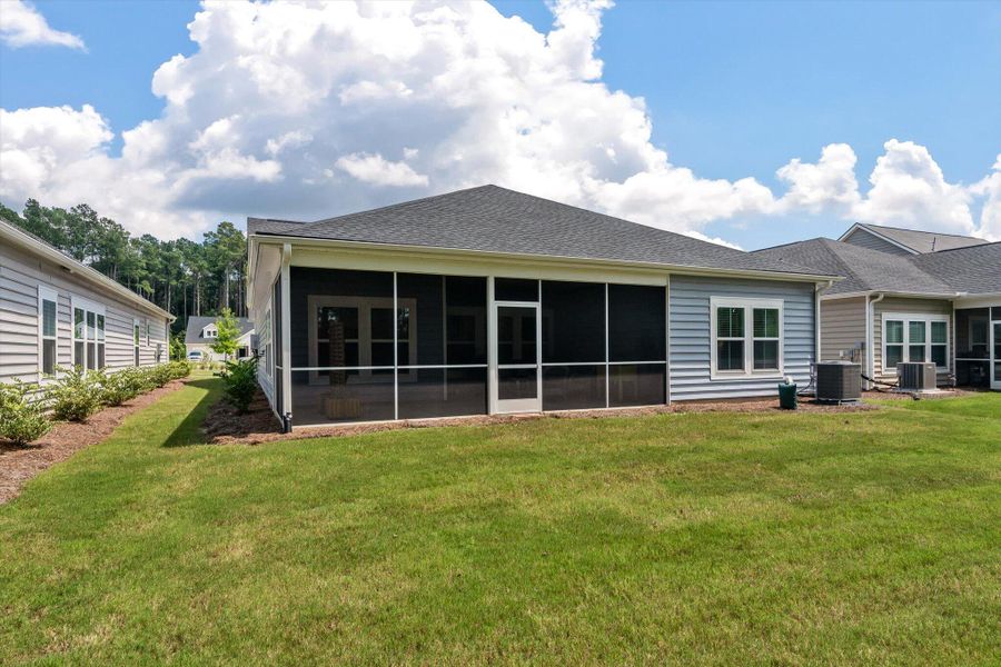 Front exterior of a new home in Horizons at Summers Corner | 55+: The Legends, Summerville, SC, highlighting curb appeal (Image 18). Front exterior of a new home in Horizons at Summers Corner | 55+: The Legends, Summerville, SC, highlighting curb appeal (Image 18).