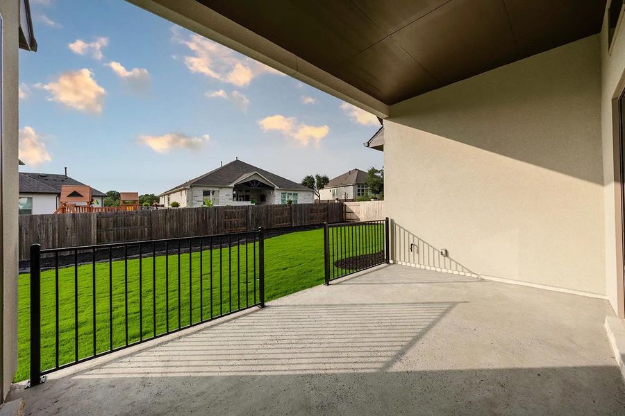 Front exterior of a new home in Caliterra - 70', Dripping Springs, TX, highlighting curb appeal (Image 18). Front exterior of a new home in Caliterra - 70', Dripping Springs, TX, highlighting curb appeal (Image 18).