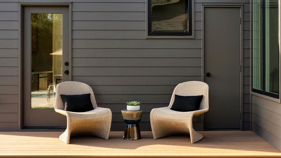 A quiet outdoor retreat features a private deck with durable horizontal siding and sleek dark trim. A quiet outdoor retreat features a private deck with durable horizontal siding and sleek dark trim.