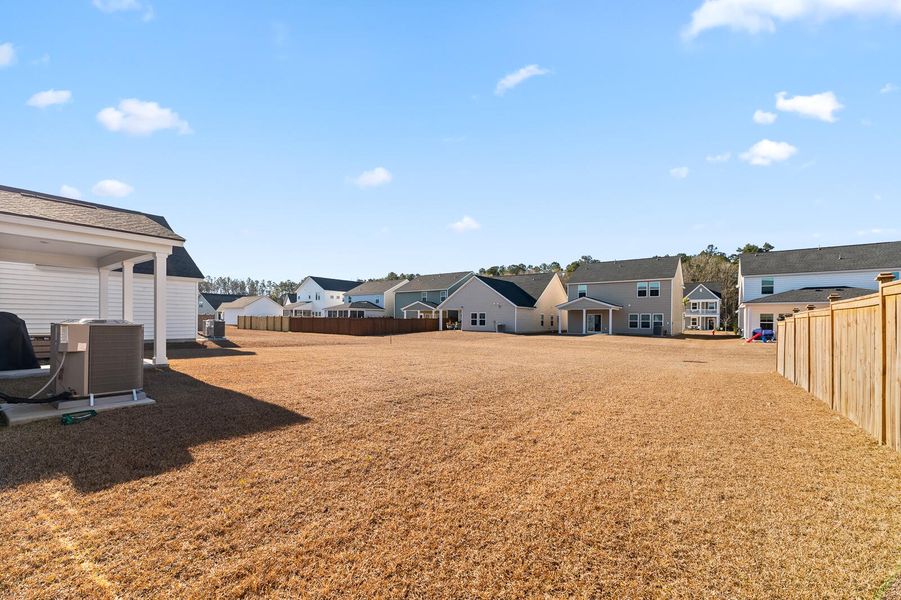 Exterior details and patio area of a home in Heron's Walk at Summers Corner, Summerville (Image 27).