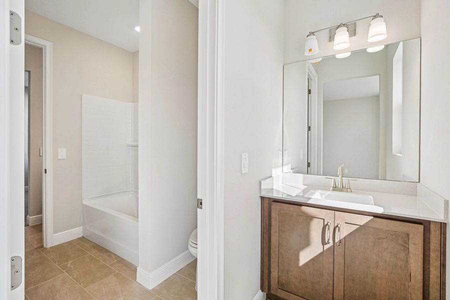 Bedroom 3 is connected to bedroom 2 via a jack and jill bathroom each bedroom has its own sink and vanity