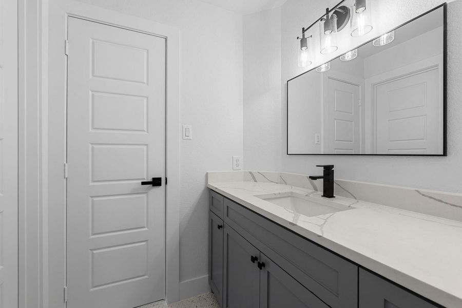 Stylish Jack & Jill bathroom featuring sleek tiled walls, a modern bathtub, and contemporary fixtures. Perfect for shared accessibility and convenience. Stylish Jack & Jill bathroom featuring sleek tiled walls, a modern bathtub, and contemporary fixtures. Perfect for shared accessibility and convenience.