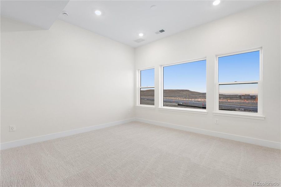 Spacious, unfurnished interior of a new home in Autograph at Lyric, Lone Tree (Image 23).