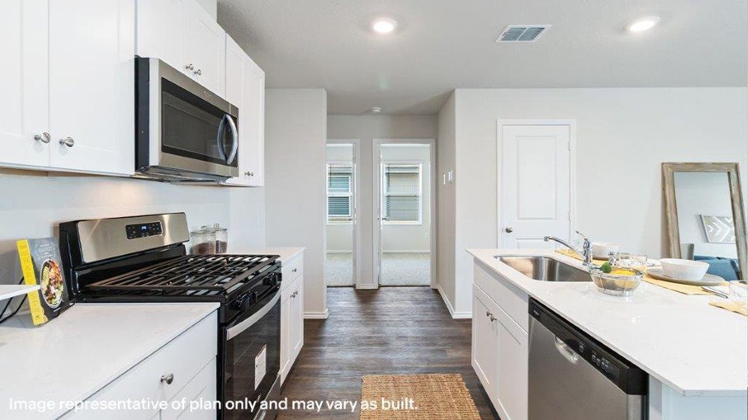 A well-equipped kitchen boasts contemporary stainless steel appliances and abundant counter space. A well-equipped kitchen boasts contemporary stainless steel appliances and abundant counter space.