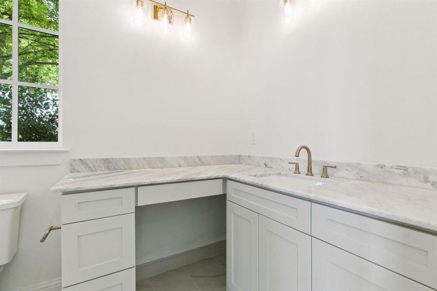 All bedrooms include an ensuite bath and walk-in closet.