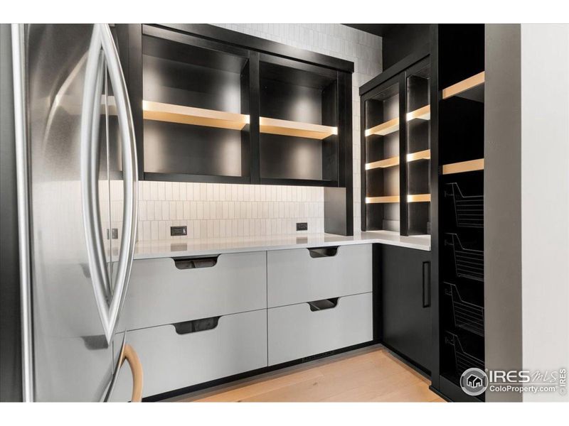 Pantry w/ accent LED lighting and additional refrigerator, custom storage