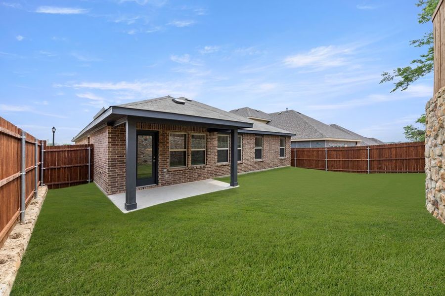 Representative exterior photo of a completed home built from the Lincoln by Impression Homes in ValleyBrooke, Mesquite, TX (Image 24).