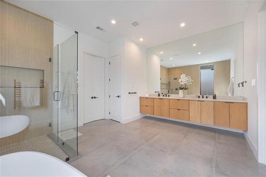 Bathroom featuring plus walk in shower and vanity