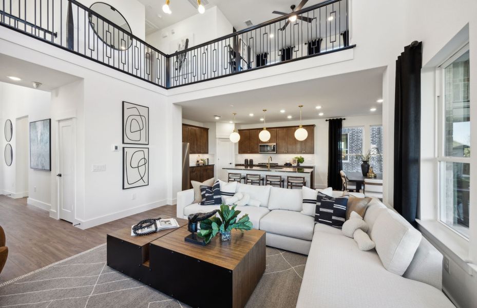 Spacious gathering room with view of kitchen