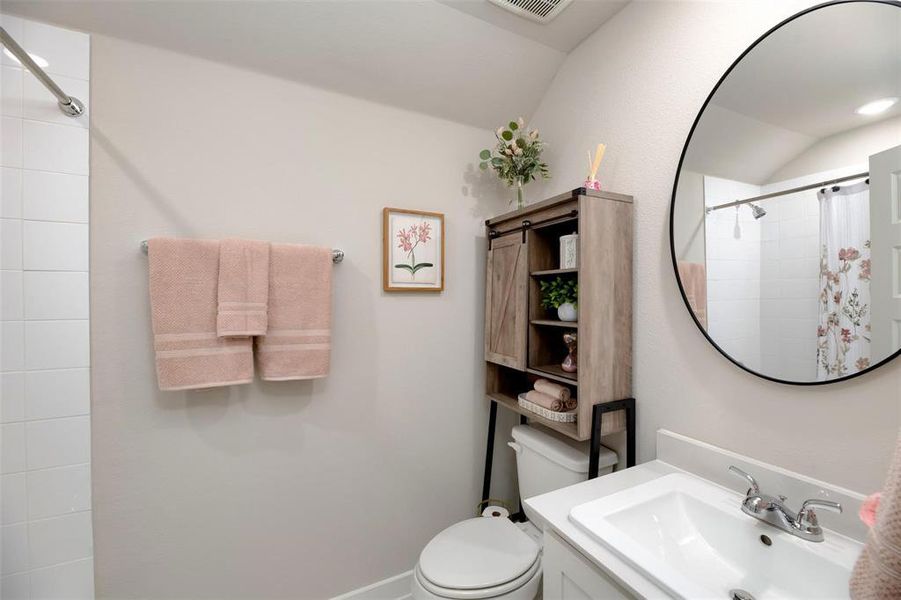Full bathroom with a shower with curtain and vanity Full bathroom with a shower with curtain and vanity