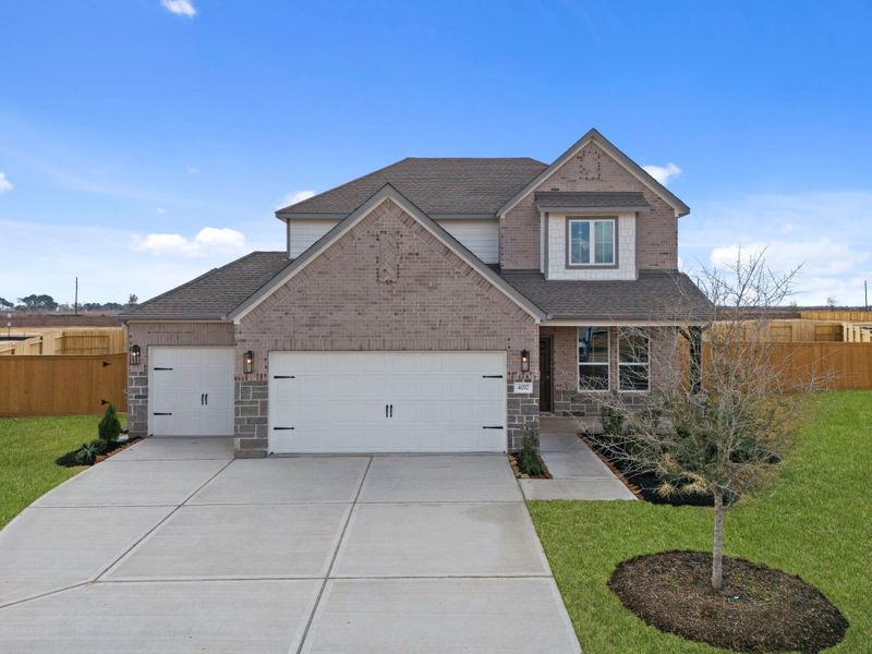 Front exterior of a new home in Sunterra Lakes, Fulshear, TX, highlighting curb appeal (Image 20). Front exterior of a new home in Sunterra Lakes, Fulshear, TX, highlighting curb appeal (Image 20).