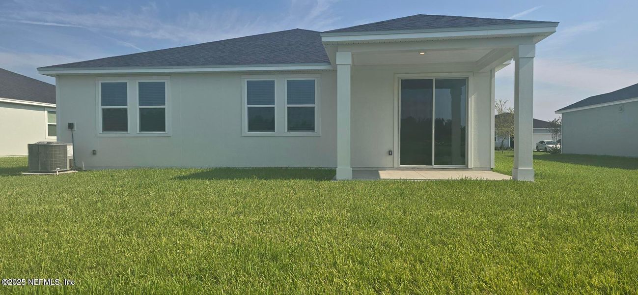 Exterior details and patio area of a home in Lakes at Bella Lago - Signature Series, Green Cove Springs (Image 3). Exterior details and patio area of a home in Lakes at Bella Lago - Signature Series, Green Cove Springs (Image 3).