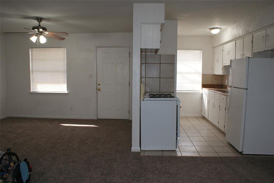 View of kitchen and entry.
