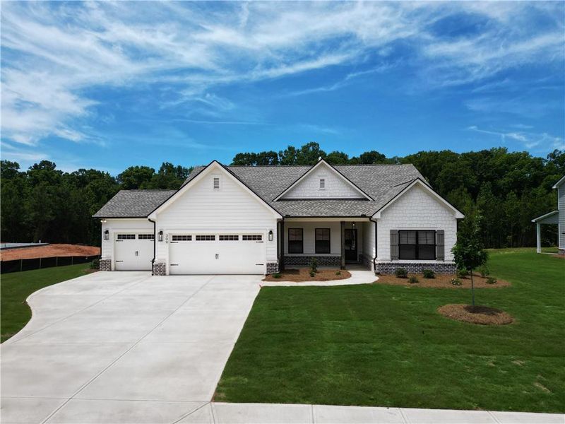 Front exterior of a new home in Weslyn Park, Social Circle, GA, highlighting curb appeal (Image 2). Front exterior of a new home in Weslyn Park, Social Circle, GA, highlighting curb appeal (Image 2).