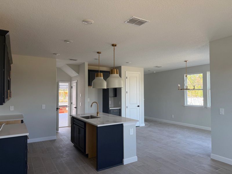 Open concept plan allows for a seamless flow between kitchen, living and dining spaces