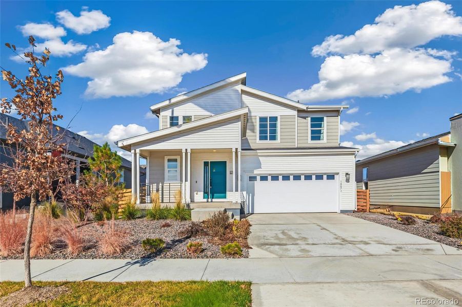Front exterior of a new home in Legato, Commerce City, CO, highlighting curb appeal (Image 2).