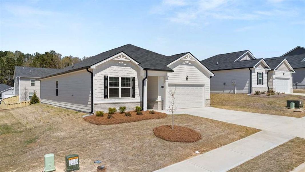 Front exterior of a new home in Champion's Run, Lithonia, GA, highlighting curb appeal (Image 18). Front exterior of a new home in Champion's Run, Lithonia, GA, highlighting curb appeal (Image 18).